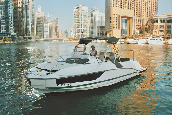 Experience Dubai's stunning skyline from the comfort of a mini yacht gliding past iconic landmarks like Dubai Marina and the Dubai Eye perfect for a memorable escape.